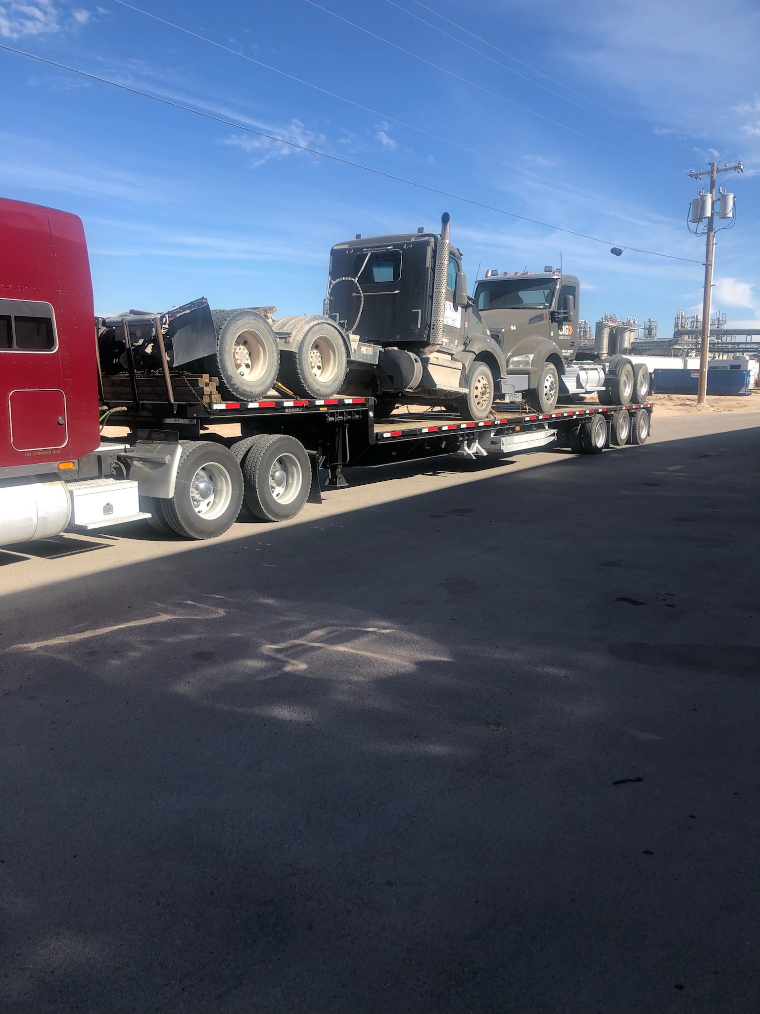 Day cab truck on step deck — driveaway often beats deck loading for roadworthy trucks