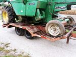 Combine loaded on a trailer for farm equipment transport