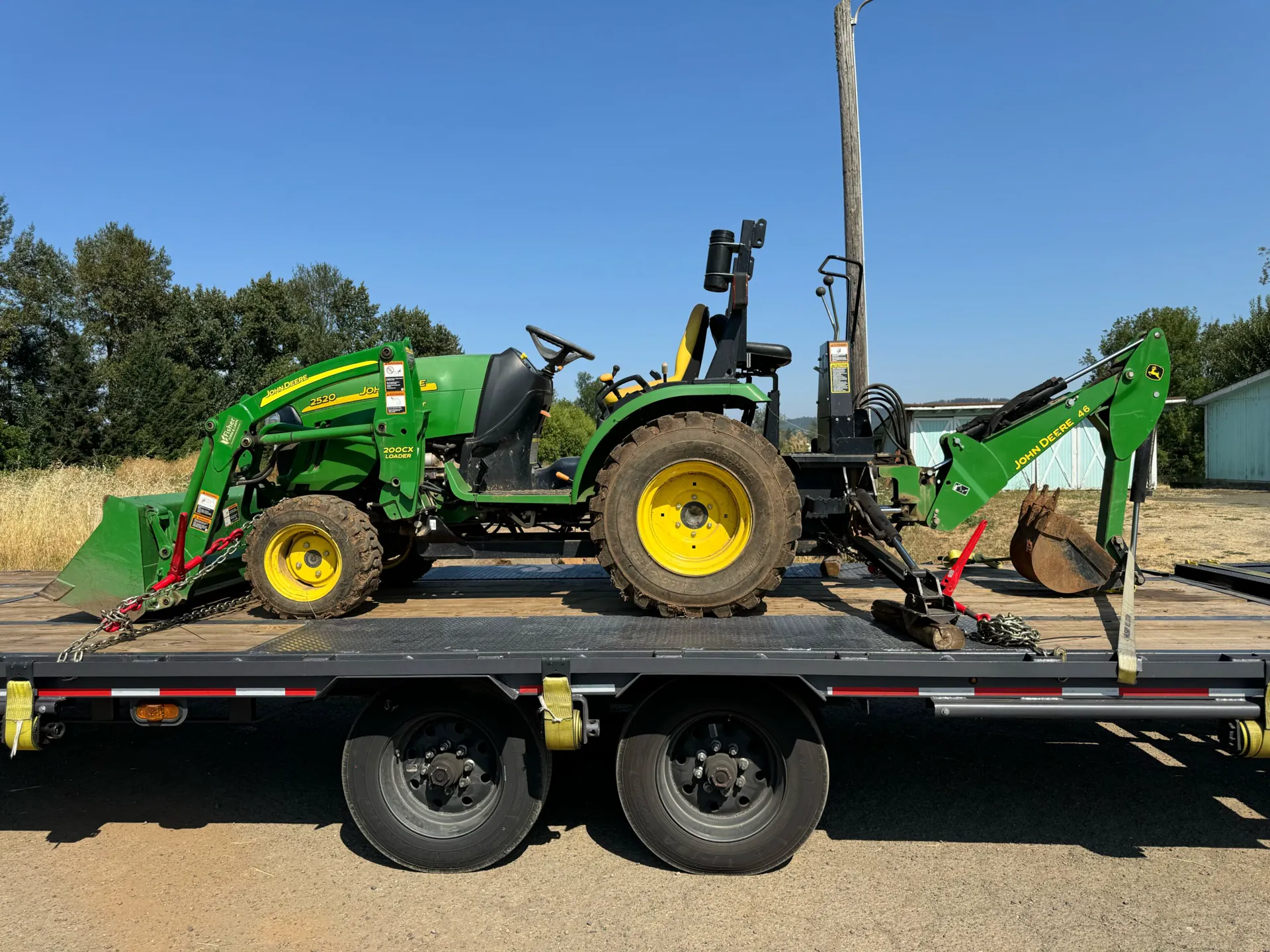 Farm tractor loaded for transport