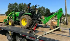 Farm tractor transport on open deck